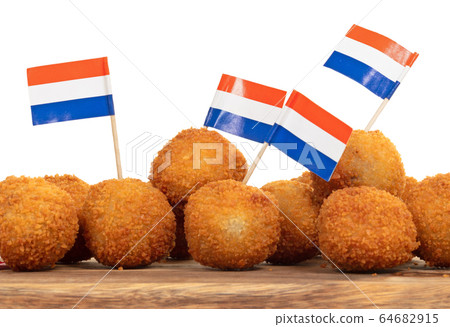 Dutch traditional snack bitterbal on a serving 64682915