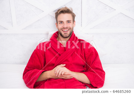 Guy in bathrobe relaxing. Relaxing before fall Guy in bathrobe relaxing. Relaxing before fall 64685260
