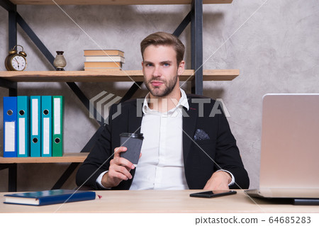 Confident man use laptop. Boss workplace. Handsome Confident man use laptop. Boss workplace. Handsome 64685283