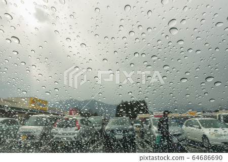 Rain on the parking lot: Raindrops Rain on the parking lot: Raindrops 64686690