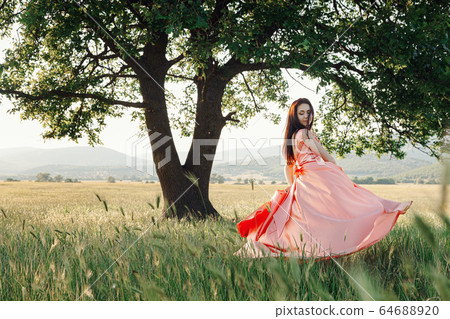 Beautiful Active Free Girl on Summer Green Outdoor Beautiful Active Free Girl on Summer Green Outdoor 64688920