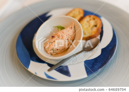 Salmon pate for an aperitif in a restaurant 64689704