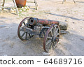 An old cannon on wheels 64689716