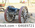 An old cannon on wheels 64689721