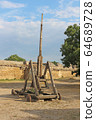 Trebuchet. Old wooden catapult 64689728