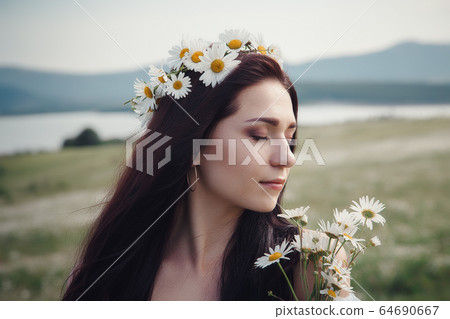 Beautiful brunette woman is enjoying spring in a Beautiful brunette woman is enjoying spring in a 64690667