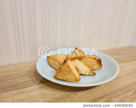 A plate of home-made mini scones 64690690