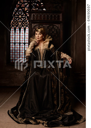 Mature woman in costume of queen Mature woman in costume of queen 64690697
