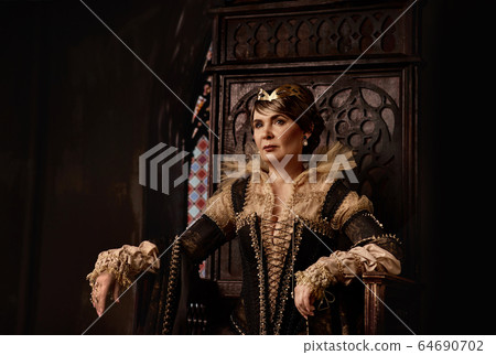 Mature woman in costume of queen Mature woman in costume of queen 64690702
