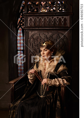 Mature woman in costume of queen Mature woman in costume of queen 64690703