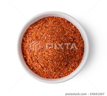 Crushed red chili pepper in white bowl on white background. top view 64691887