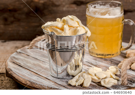 cheese appetizer and beer on vintage background 64693640