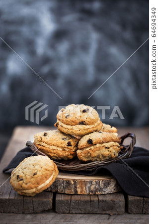 Homemade oatmeal sandwich cookies 64694349