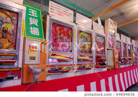 Pachinko machine at a stall on a fair day 64694656