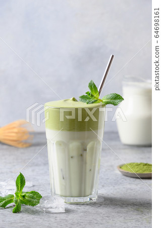 Dalgona Matcha latte tea with milk and whipped tea 64698161