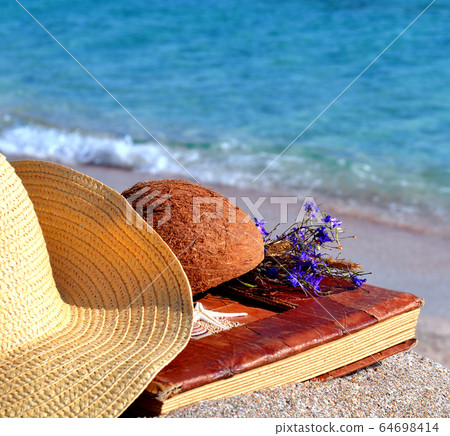 Vintage photo album on the beach 64698414