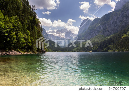 Vorderer Gosausee lake near Gosau with melting glacier in background, Austria, sunny summer day Vorderer Gosausee lake near Gosau with melting glacier in background, Austria, sunny summer day 64700707