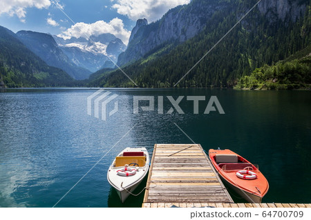 Vorderer Gosausee lake near Gosau with melting glacier in background, Austria, sunny summer day Vorderer Gosausee lake near Gosau with melting glacier in background, Austria, sunny summer day 64700709
