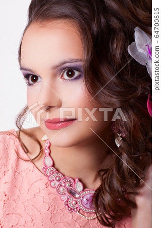 portrait of a woman with make-up with pink 64700815