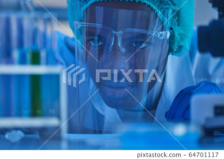 African chemist working with samples African chemist working with samples 64701117