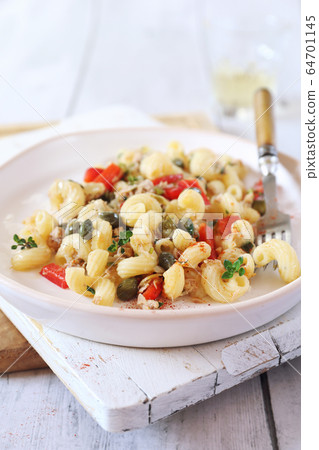 Italian pasta fusilli salad with tuna, bell pepper and cappers 64701145