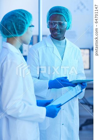 Two doctors discussing medical exam 64701147