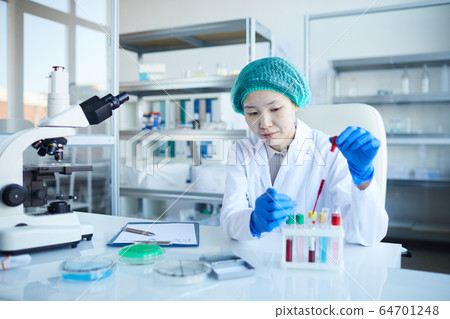 Doctor making test with blood samples Doctor making test with blood samples 64701248