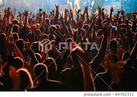 Fans at live rock music concert cheering Fans at live rock music concert cheering 64701331