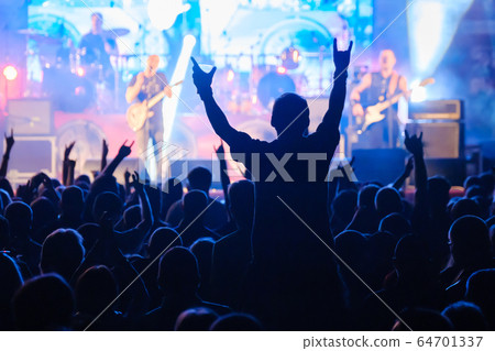 Fans at live rock music concert cheering Fans at live rock music concert cheering 64701337