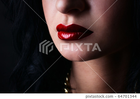 red lips brunette. fashion. on a black background 64701344