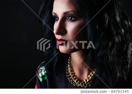 Portrait of pretty brunette with red lips in flower Sweatshirts tenderly looks away Portrait of pretty brunette with red lips in flower Sweatshirts tenderly looks away 64701345