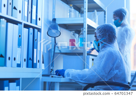 Scientist working on computer 64701347