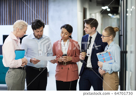 Business people preparing for meeting Business people preparing for meeting 64701730