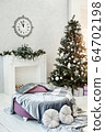 Beautiful modern interior decorated with Christmas decor. The artificial fireplace is white. 64702198