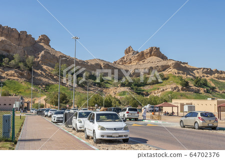 Mountains near the hot thermal springs in the United Arab Emirates near Ain Al. 64702376