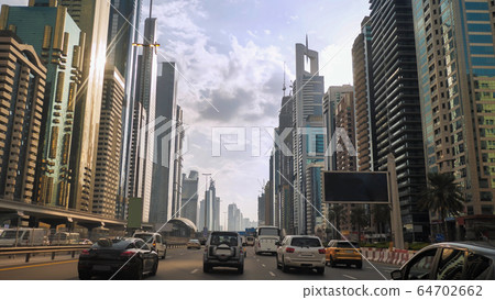 Drive along Sheikh Zayed Road in Dubai. Drive along Sheikh Zayed Road in Dubai. 64702662