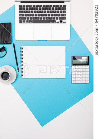School and office supplies lie neatly on a white and blue background School and office supplies lie neatly on a white and blue background 64702923