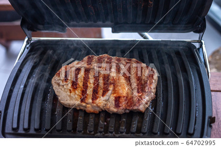 beef steak on electric grill ribs beef steak on electric grill ribs 64702995