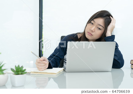 Student sitting in living room and learning online 64706639