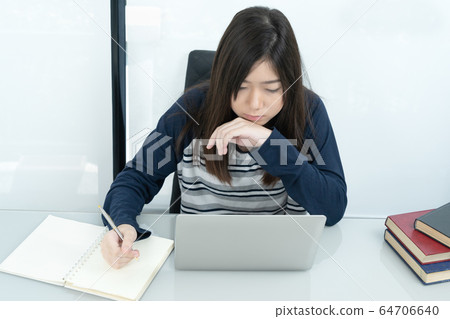 Student sitting in living room and learning online 64706640