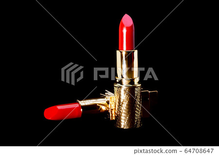 beautiful Red lipstick in gold slipcover on black background make up and cosmetic concept,beauty and fashion beautiful Red lipstick in gold slipcover on black background make up and cosmetic concept,beauty and fashion 64708647