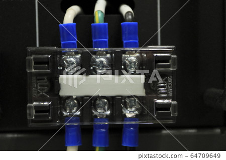 Panel with electrical wires and screws visible Panel with electrical wires and screws visible 64709649