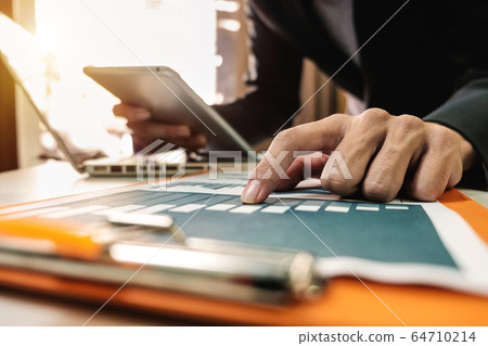 Hands of woman using mobile phone in modern office with laptop and digital tablet at home office Hands of woman using mobile phone in modern office with laptop and digital tablet at home office 64710214