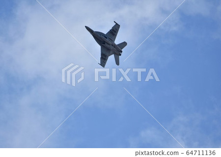 FA-18 fighter attack aircraft of the US Navy flying in the sky FA-18 fighter attack aircraft of the US Navy flying in the sky 64711136