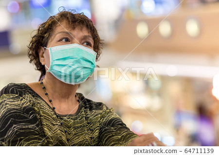 Old asian woman in a mask for COVID-19, Old asian woman in a mask for COVID-19, 64711139