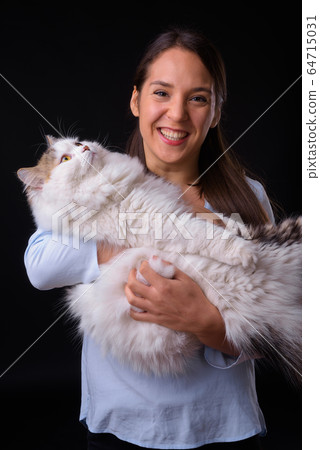 Young multi ethnic beautiful businesswoman against black background 64715031