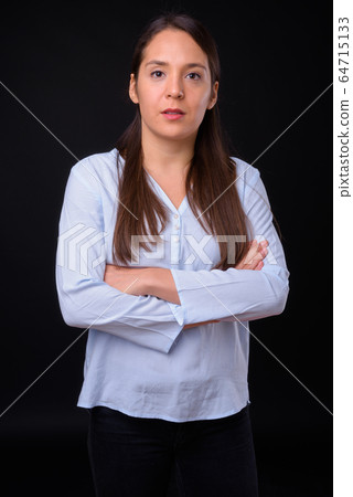 Young multi ethnic beautiful businesswoman against black background 64715133