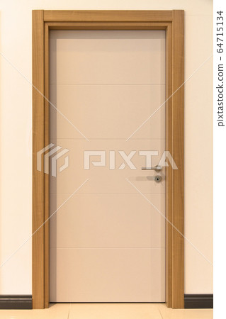 Modern white and brown front wooden door in house 64715134