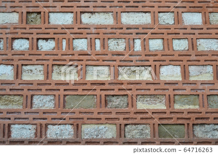 Sturdy beige and red cut stone wall, seamless 64716263