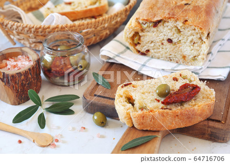 Mediterranean cuisine. Sourdough bread with dried tomatoes and olives Mediterranean cuisine. Sourdough bread with dried tomatoes and olives 64716706